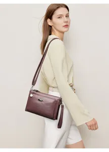 Detailed close-up view of women PU leather multi-layer crossbody bag in dark purple