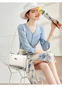 Close-up detail of the white PU leather shoulder bag showcasing elegant multi-layer design.