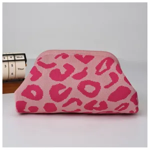 Pink knit leopard print cloud pouch bag detail, soft fabric texture, stylish accessory.