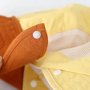 Detail view of kids sun hat brim, showing breathable mesh lining and secure snap button.