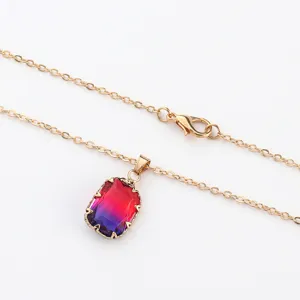 Gold-plated necklace featuring a stunning rectangular gradient crystal pendant for women.