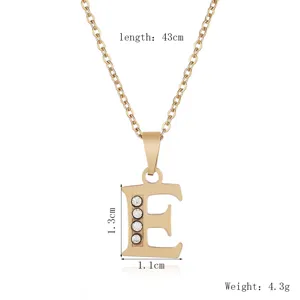Gold stainless steel letter E pendant necklace with sparkling rhinestones, 43cm chain length.