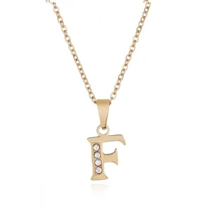 Detailed view of the gold stainless steel rhinestone letter F pendant necklace, delicate chain.