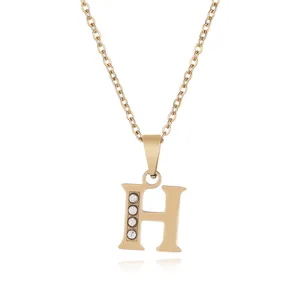 Detailed close-up view of the golden stainless steel letter H pendant necklace with sparkling gems.