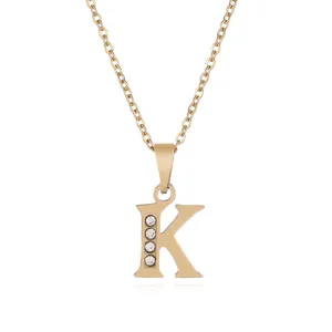Stainless steel gold-plated letter K pendant necklace with sparkling rhinestones for women fashion.