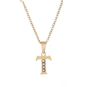 Gold stainless steel letter T pendant necklace detail with sparkling rhinestone crystals.