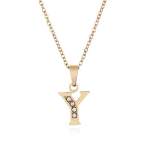 Stainless steel letter Y pendant necklace detailed view, gold tone jewelry chain with crystals.