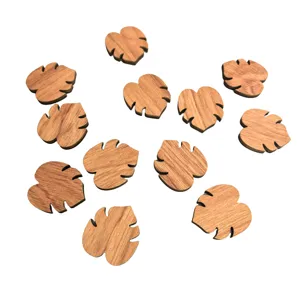 Detailed view of natural wooden leaf shaped craft pieces, perfect for DIY decoration projects.