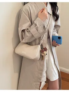 Minimalist woven pillow shoulder bag for women, chic neutral underarm handbag daily use