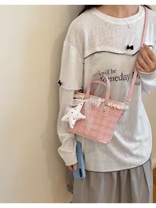 Pink plaid bucket bag with lace trim and star pendant for women daily casual crossbody style.