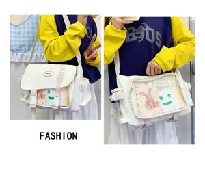 Casual white ita bag college style messenger bag with clear window for daily use and pins.