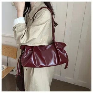 Burgundy oil leather shoulder bag baguette style for daily commuting elegant fashion detail view