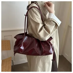 Stylish burgundy oily leather shoulder bag for women, large capacity retro commuting handbag.