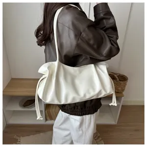 White oil leather ruched shoulder bag detail, soft baguette design for daily chic commute.