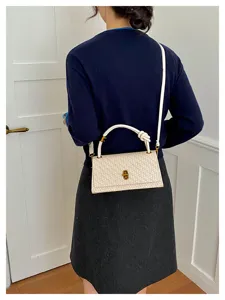 Korean style woven crossbody bag detail view, chic rectangular shoulder bag with knot handle.
