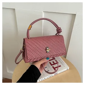 Chic pink woven leather crossbody bag for women, stylish minimalist top handle purse with lock.
