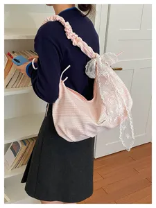 Sweet pink canvas shoulder bag with lace ruffles and stylish stripe design for daily commute.