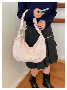 Pink plaid canvas shoulder bag with unique scrunchie strap and bow tie for women daily style.