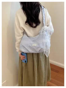 Blue and white striped canvas shoulder bag with elegant lace trim, casual large capacity daily.