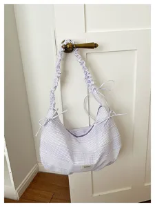 Stylish purple checkered canvas shoulder bag with scrunchie straps and cute side bow details.