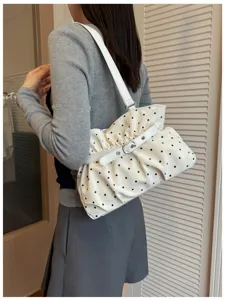 Korean style pleated polka dot shoulder bag detail view, soft leather design with buckle accent.