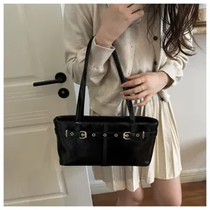 Stylish black patent leather shoulder bag for women, chic minimal design with double buckles.