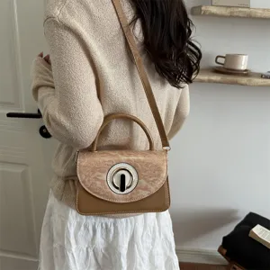Bolso de hombro elegante de charol marrón con diseño de cierre de anillo único para mujeres