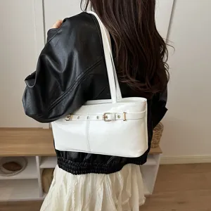 Minimalist white leather shoulder bag for women, trendy underarm tote for daily work commute.