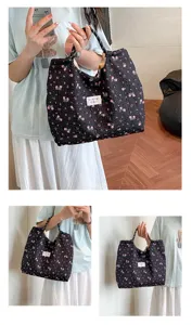 Detailed view of floral quilted tote bag, stylish large capacity casual shoulder bag.