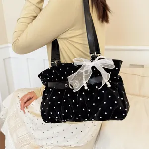 Women black polka dot pleated shoulder bag with pearl bow, casual soft leather crossbody bag.