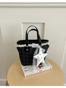 Plaid bucket bag with lace trim and star pendant, elegant daily handbag detail.