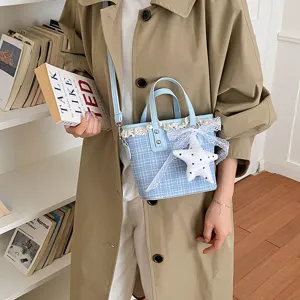 Blue plaid bucket bag with lace trim and star pendant, casual chic shoulder handbag for women.