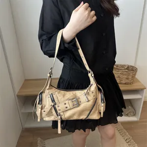 Trendy women shoulder baguette bag, stylish casual PU leather crossbody handbag with zippers.