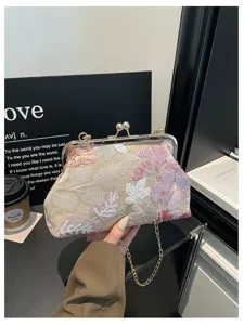 Elegante borsa da sera a pochette ricamata con paillettes e chiusura metallica da donna.