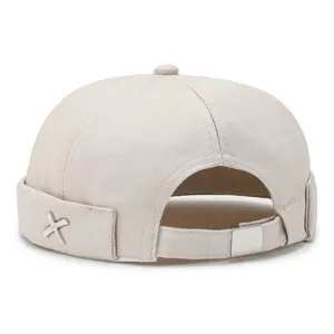 Minimalist beige docker hat for men and women, stylish brimless sailor cap street style.