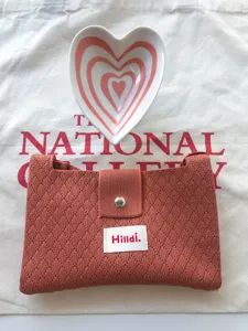Casual knit crossbody bag with magnetic snap, stylish women's mini knitted coin purse.