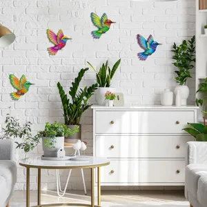 Colorful metal hummingbird wall art detail showing vibrant outdoor garden fence decor structure