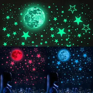 Glow in the dark star and moon wall stickers detail showing luminous night sky effect for room.