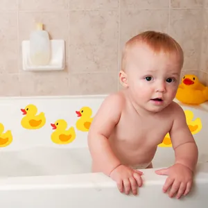 Close-up detail of cute yellow duck non-slip bathtub stickers showing textured anti-slip surface.
