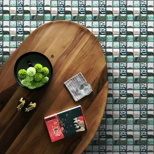 Green and white mosaic tile sticker detail showing glossy texture and waterproof design for home decor.