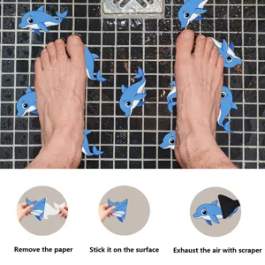 Detail view of cute dolphin anti slip bathroom stickers application steps on tiled floor surface.