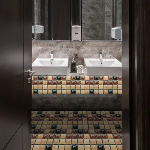 Mosaic tile sticker detail showing colorful geometric wall and floor decor pattern in bathroom.