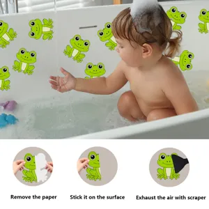 Detailed view of cute green frog bathtub anti-slip stickers with usage step guide.