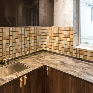 Detailed close-up view of wooden mosaic tile sticker applied in modern kitchen backsplash.