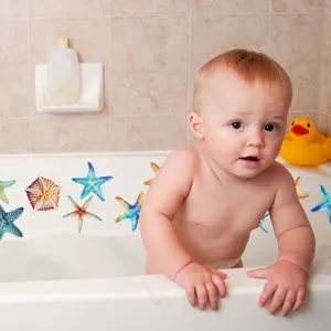 Detailed shot of colorful starfish non-slip bathtub stickers in use, safe and practical bathroom decor.