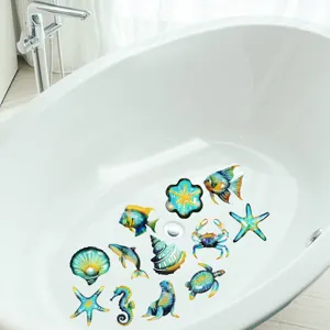 Detailed view of colorful marine animal anti-slip stickers attached inside a clean white bathtub.