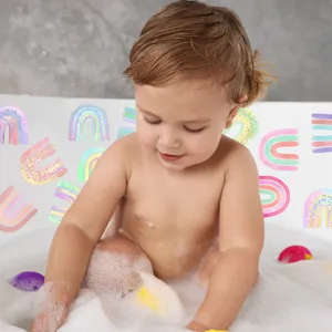 Detail view of colorful rainbow non-slip bathtub stickers used in a home bathroom.