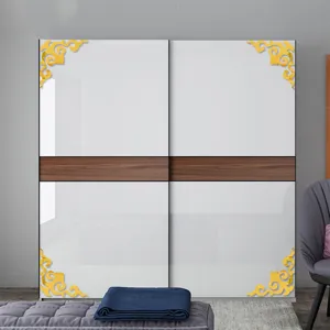Detail view of golden acrylic corner stickers applied on modern wardrobe for home decoration.