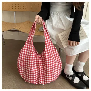 Red and white gingham fabric shoulder bag detail shot, casual style daily hobo bag accessory.