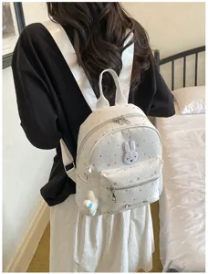 Fashion chic star print mini backpack with cute rabbit patch and casual design for women.